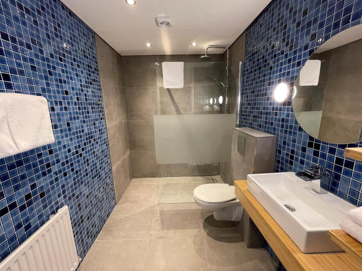 Hotel Restaurant Stad Munster Винтерсвейк Екстериор снимка Bathroom at the hotel